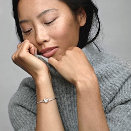 Silver bangle with heart-shaped clasp