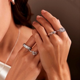 Pandora logo sterling silver and 14k rose gold-plated ring with clear cubic zirconia